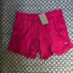 Pink Nike Dri-FIT shorts.